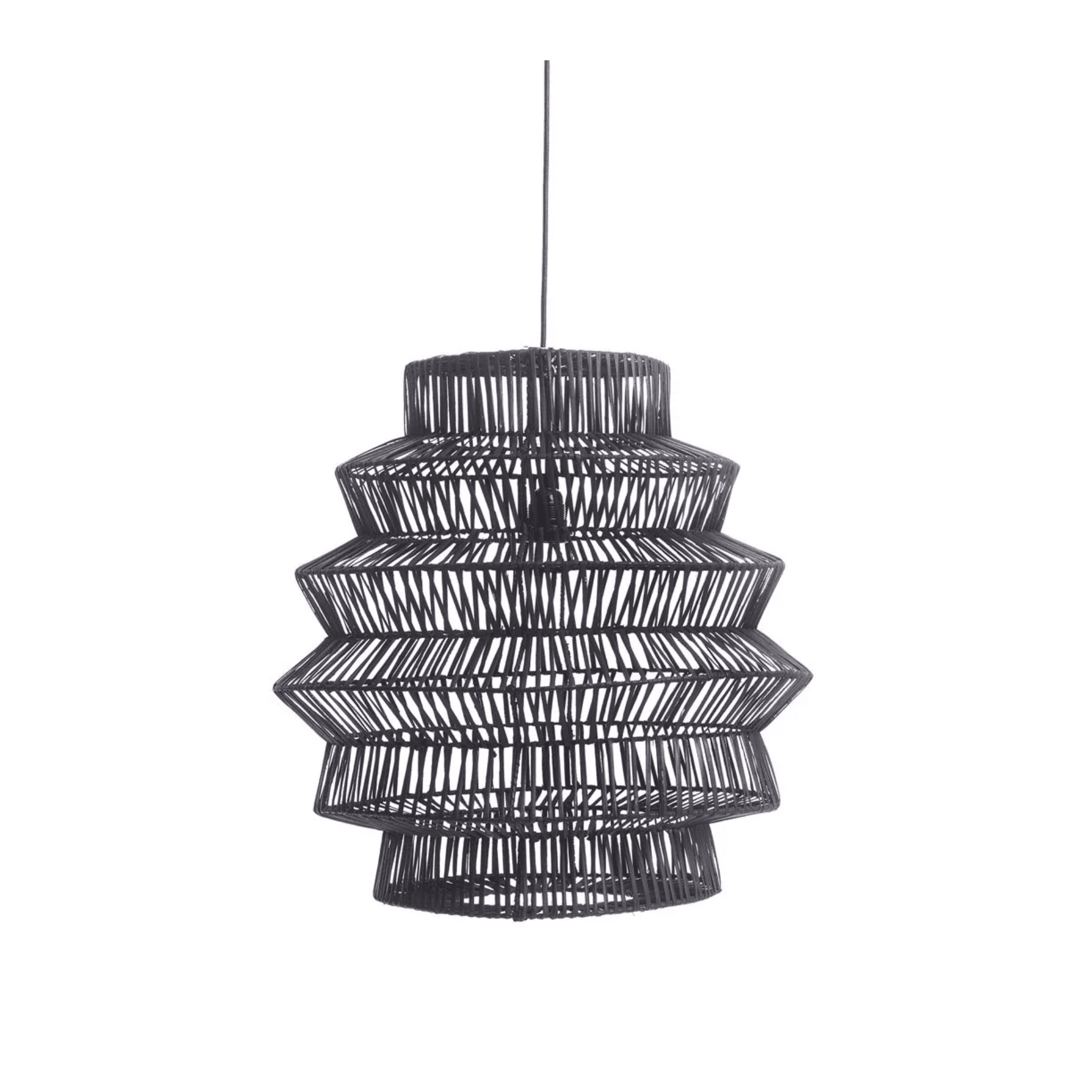 Handwoven rattan pendant light with a sculptural dome shape, creating warm ambient glow in a minimalist dining room
