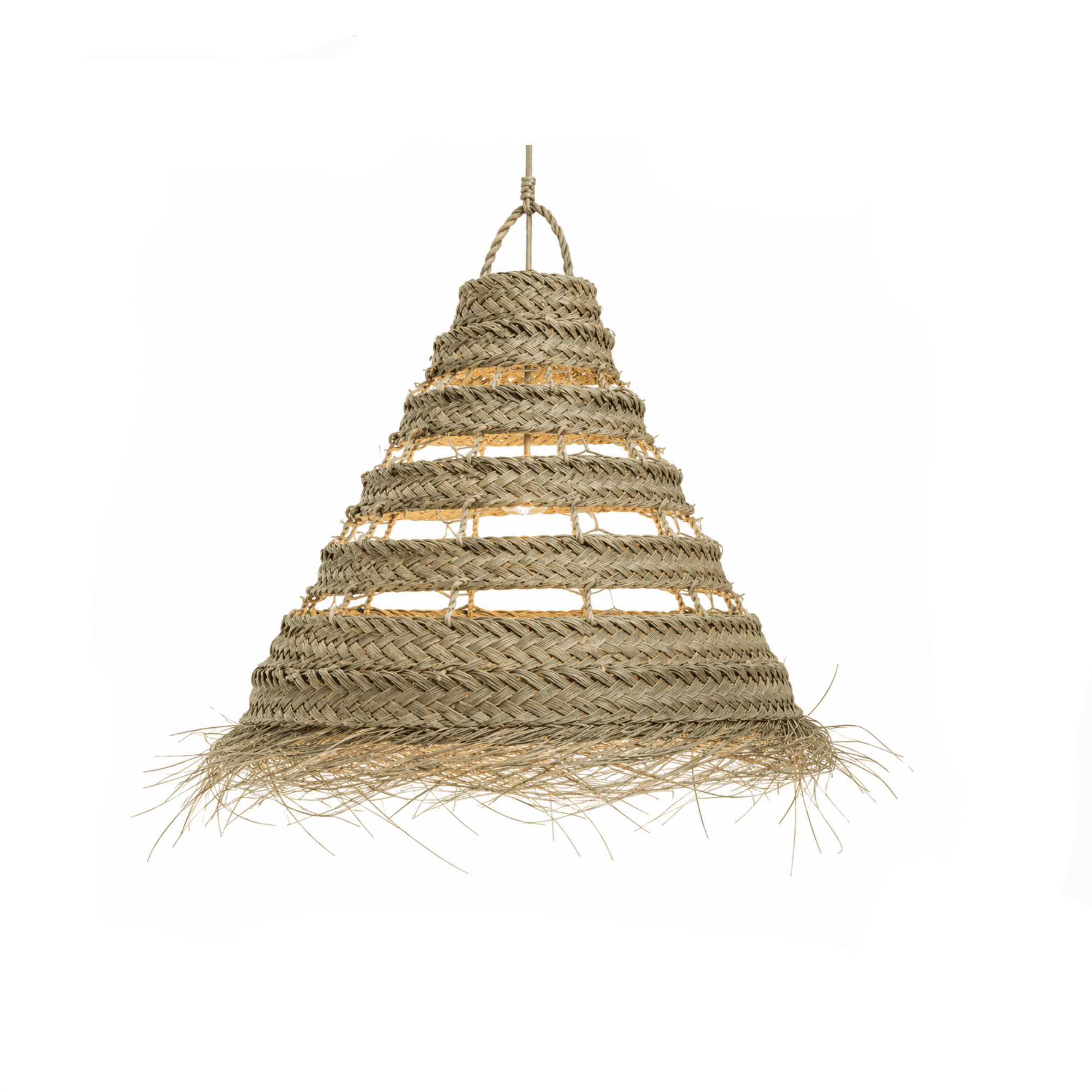 Conical woven lampshade of natural fibers with loose ends at the bottom, emitting warm light